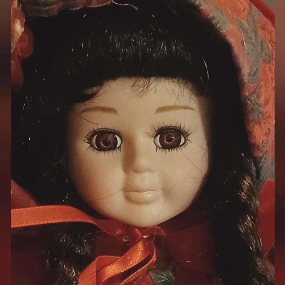 Porcelain Doll with Red and Black Outfit